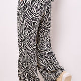 Lightweight, woven and textured, these wide-leg trousers are designed to create a fluid silhouette. Boasting a bold zebra print, they feature an elastic panel at the waist for a comfortable fit, a hook and zip fastening, plus practical pockets.