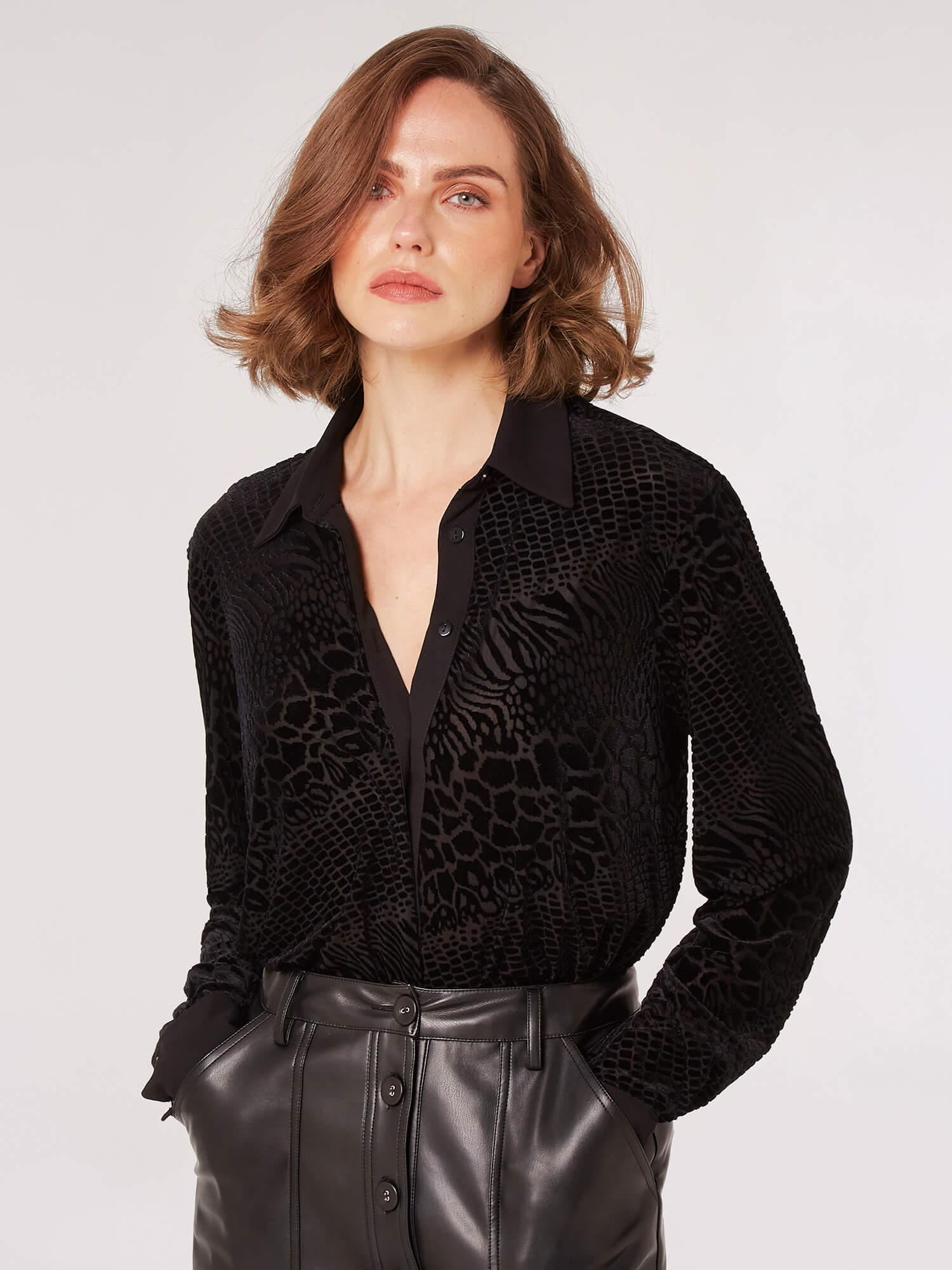 Look wild and stylish with this animal print top! Featuring a tone on tone black pattern and flattering silhouette, this shirt will have you looking your best for any occasion
