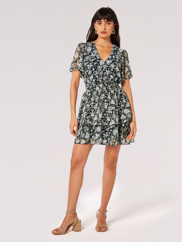 With a pretty watercolour rose print, this mini dress is the perfect option for all your weekend plans. Crafted from lightweight chiffon and lined for comfort, this sunshine-ready dress boasts a flattering V-neckline, a smocked waist for a defined fit, angel sleeves and a skirt that falls in fluid tiers. Style it with strappy sandals to complete the look.