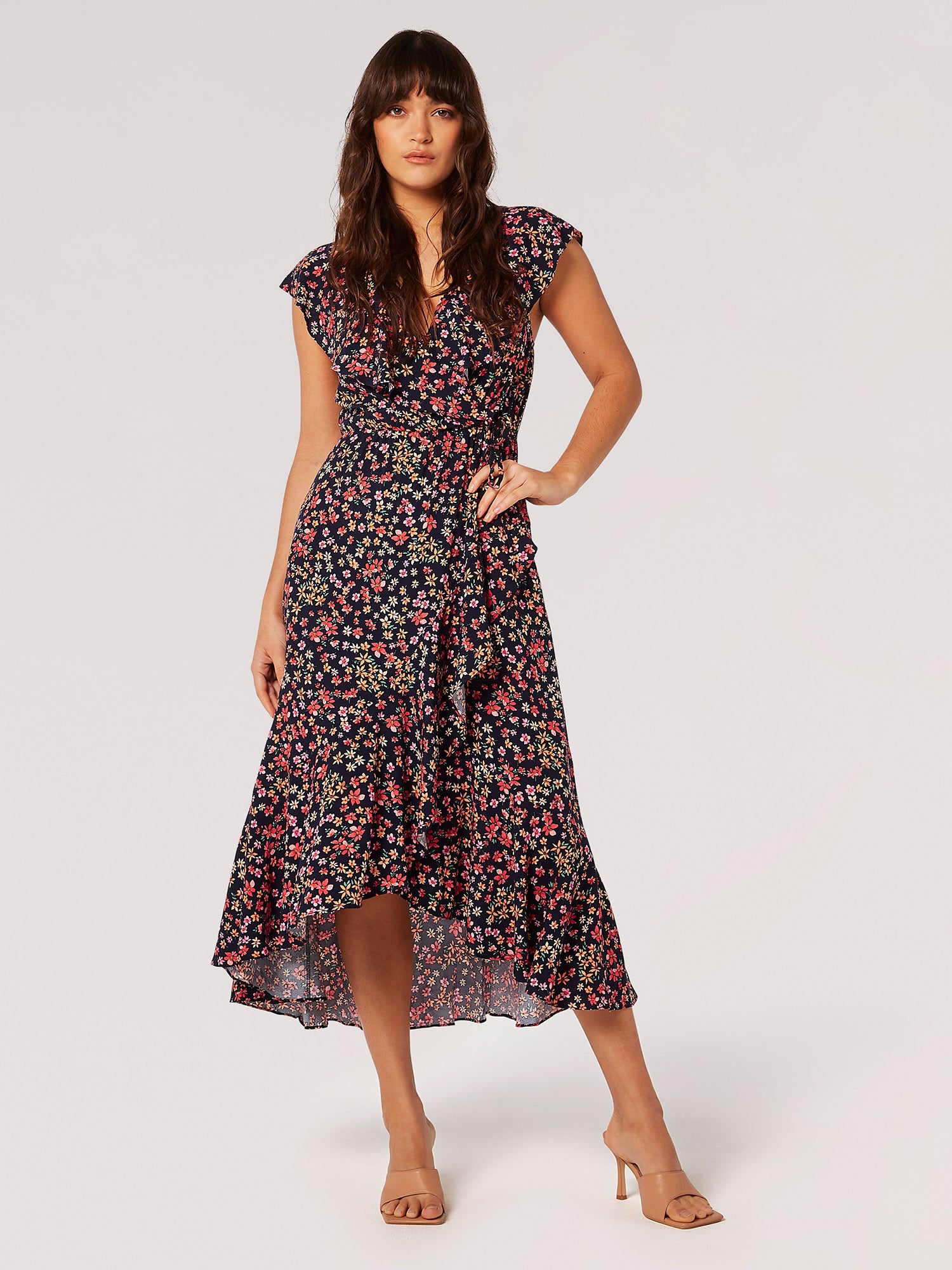 This floral-printed midi is the perfect pick for special occasions. Lightweight and woven, it features a flattering wrap design with a plunging V-neckline, an elastic waist with a tie for a comfortable yet defining fit, and a skirt that cascades in ruffles. It's finished with a high-low hem to create a sense of movement. Pair with heeled sandals for a polished finish.