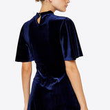 Look absolutely divine in this stunning Navy Apricot Velvet Flare Dress. This dress looks great in motion with its flare silhouette, luxe velvet fabric, and deep navy hue. 