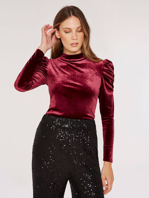 If you're looking for something unique and special to add to your wardrobe, the Apricot Velvet Rouched Shoulder Top won't disappoint. 