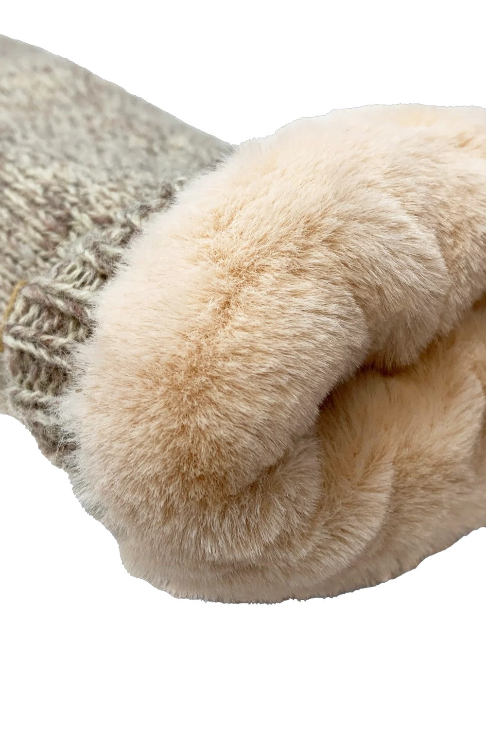 Close-up of a sock with fur trim on a white background