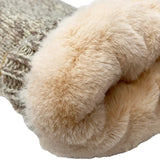 Close-up of a sock with fur trim on a white background