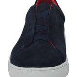 Discover our elegant navy blue suede sneaker, designed to combine comfort and versatility. The shoe features a vibrant red trim that adds a splash of color, making it a perfect choice for casual outings or sporting activities. Made from high-quality materials, this sneaker ensures durability while offering a comfortable fit for all-day wear. Enhance your shoe collection with this modern, chic design.