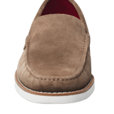 This elegant and refined tan loafer features a bold red sole, adding a modern touch to a classic design. Crafted from high-quality materials, it offers optimum comfort while being perfect for both formal and casual occasions. Its timeless style makes it a must-have for any sophisticated wardrobe.