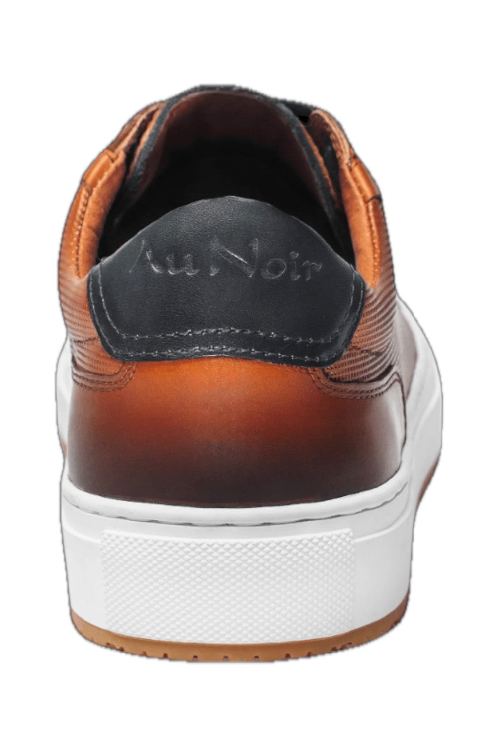 This cognac leather sneaker features a sleek design complemented by stylish white trim, making it a versatile addition to any wardrobe. Made from high-quality materials, it offers both durability and comfort, ideal for casual outings or everyday wear. The combination of classic black and crisp white ensures a modern aesthetic, while the sneaker's lightweight construction offers ease of movement. Perfect for those seeking a blend of fashion and functionality.