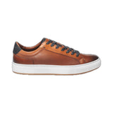 This cognac leather sneaker features a sleek design complemented by stylish white trim, making it a versatile addition to any wardrobe. Made from high-quality materials, it offers both durability and comfort, ideal for casual outings or everyday wear. The combination of classic black and crisp white ensures a modern aesthetic, while the sneaker's lightweight construction offers ease of movement. Perfect for those seeking a blend of fashion and functionality.