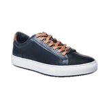 This navy blue leather sneaker features a sleek design complemented by stylish white trim, making it a versatile addition to any wardrobe. Made from high-quality materials, it offers both durability and comfort, ideal for casual outings or everyday wear. The combination of classic black and crisp white ensures a modern aesthetic, while the sneaker's lightweight construction offers ease of movement. Perfect for those seeking a blend of fashion and functionality.