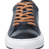 This navy blue leather sneaker features a sleek design complemented by stylish white trim, making it a versatile addition to any wardrobe. Made from high-quality materials, it offers both durability and comfort, ideal for casual outings or everyday wear. The combination of classic black and crisp white ensures a modern aesthetic, while the sneaker's lightweight construction offers ease of movement. Perfect for those seeking a blend of fashion and functionality.