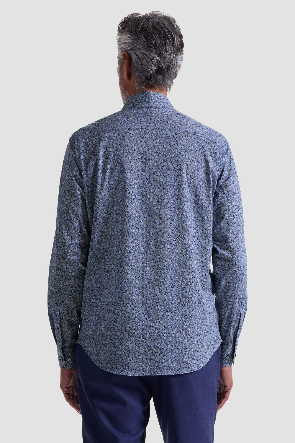 The James OoohCotton long-sleeved shirt in leaf print features a point collar, mother-of-pearl buttons, and a curved hem for a sleek tucked or untucked look. The notched cuffs are adjustable to allow for customized fit and also convertible to accommodate cufflinks. OoohCotton® is a performance, double-mercerized, wrinkle-resistant, breathable, and easy-care cotton blend with 8-way stretch, quick-dry, and thermal comfort properties.