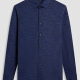 The James OoohCotton long-sleeved shirt in marbled print features a point collar and a curved hem for a sleek tucked or untucked look. The notched cuffs are adjustable to allow for customized fit and also convertible to accommodate cufflinks. OoohCotton® is a performance, double-mercerized, wrinkle-resistant, breathable, and easy-care cotton blend with 8-way stretch, quick-dry, and thermal comfort properties.