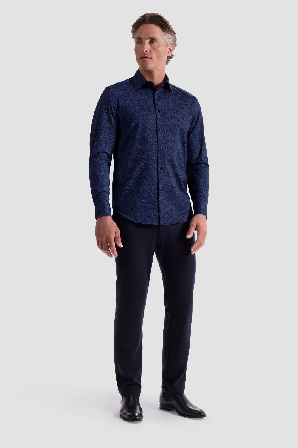 The James OoohCotton long-sleeved shirt in marbled print features a point collar and a curved hem for a sleek tucked or untucked look. The notched cuffs are adjustable to allow for customized fit and also convertible to accommodate cufflinks. OoohCotton® is a performance, double-mercerized, wrinkle-resistant, breathable, and easy-care cotton blend with 8-way stretch, quick-dry, and thermal comfort properties.