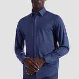 The Jules OoohCotton long-sleeved shirt in geometric print features a hidden button-down collar, mother-of-pearl buttons, and a curved hem for a sleek tucked or untucked look. The notched cuffs are adjustable to allow for customized fit and also convertible to accommodate cufflinks. OoohCotton® is a performance, double-mercerized, wrinkle-resistant, breathable, and easy-care cotton blend with 8-way stretch, quick-dry, and thermal comfort properties.