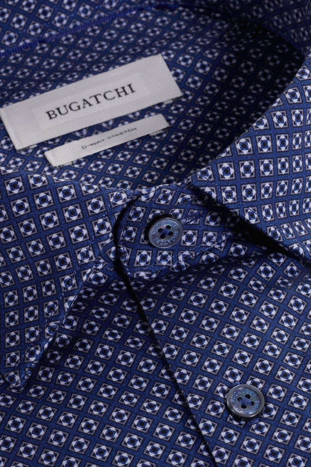 The Jules OoohCotton long-sleeved shirt in geometric print features a hidden button-down collar, mother-of-pearl buttons, and a curved hem for a sleek tucked or untucked look. The notched cuffs are adjustable to allow for customized fit and also convertible to accommodate cufflinks. OoohCotton® is a performance, double-mercerized, wrinkle-resistant, breathable, and easy-care cotton blend with 8-way stretch, quick-dry, and thermal comfort properties.