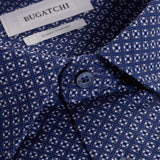 The Jules OoohCotton long-sleeved shirt in geometric print features a hidden button-down collar, mother-of-pearl buttons, and a curved hem for a sleek tucked or untucked look. The notched cuffs are adjustable to allow for customized fit and also convertible to accommodate cufflinks. OoohCotton® is a performance, double-mercerized, wrinkle-resistant, breathable, and easy-care cotton blend with 8-way stretch, quick-dry, and thermal comfort properties.