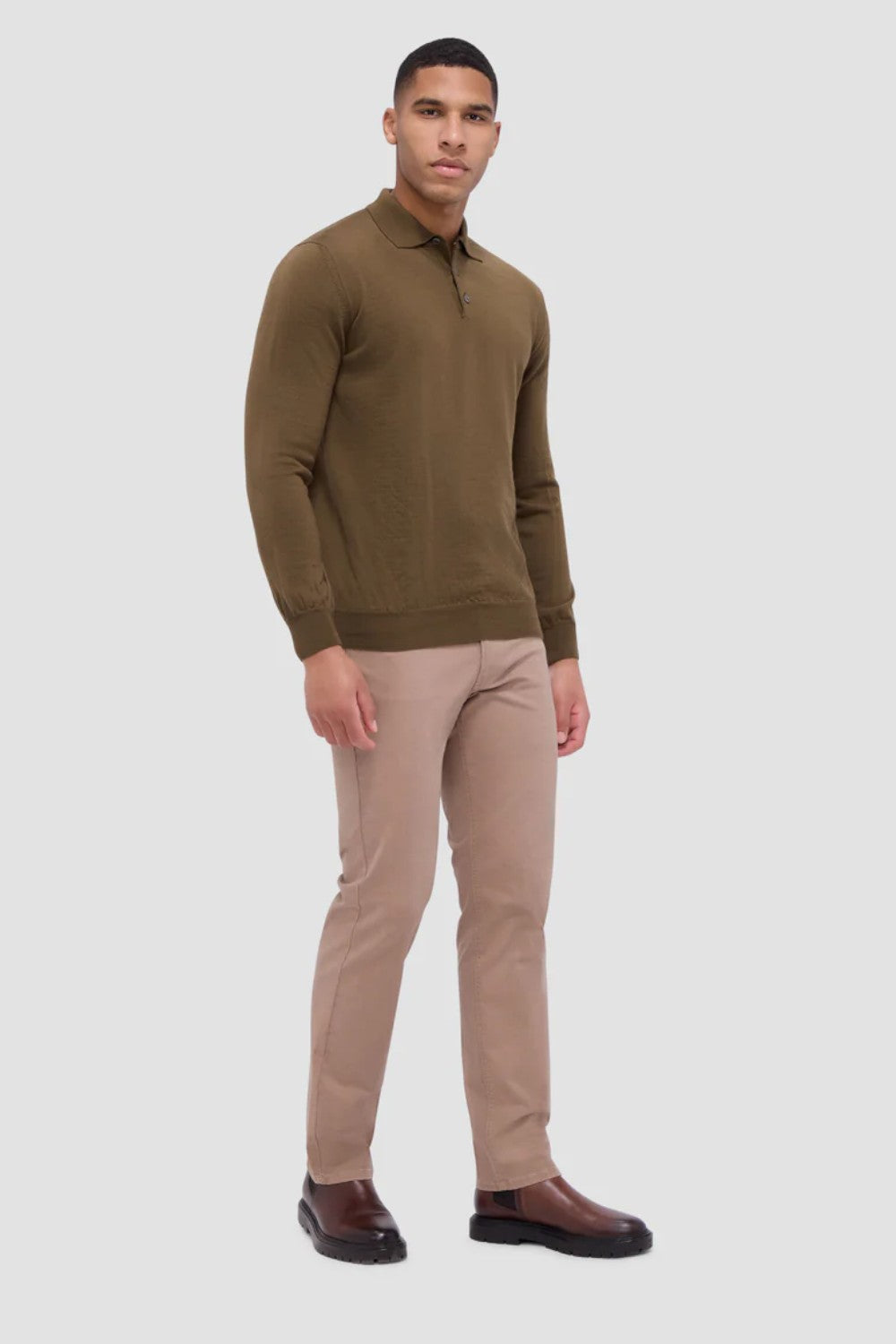 This timeless polo sweater in 100% extra fine merino wool with Harmony 4.0 special finish is made in Italy and features a classic three button placket and ribbed cuffs, and waistband. Unequalled in softness and comfort, it is made with a high twist yarn that is breathable, hygroscopic, water-repellent, machine washable, and crease-proof, ensuring long-lasting performance wash after wash.