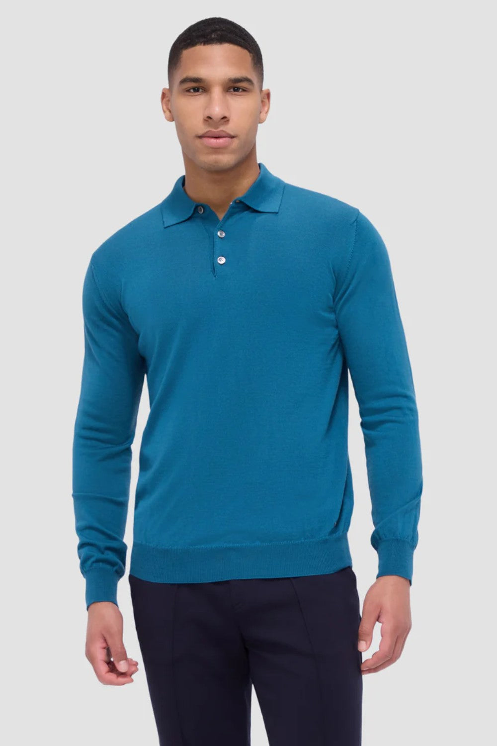 This timeless polo sweater in 100% extra fine merino wool with Harmony 4.0 special finish is made in Italy and features a classic three button placket and ribbed cuffs, and waistband. Unequalled in softness and comfort, it is made with a high twist yarn that is breathable, hygroscopic, water-repellent, machine washable, and crease-proof, ensuring long-lasting performance wash after wash.