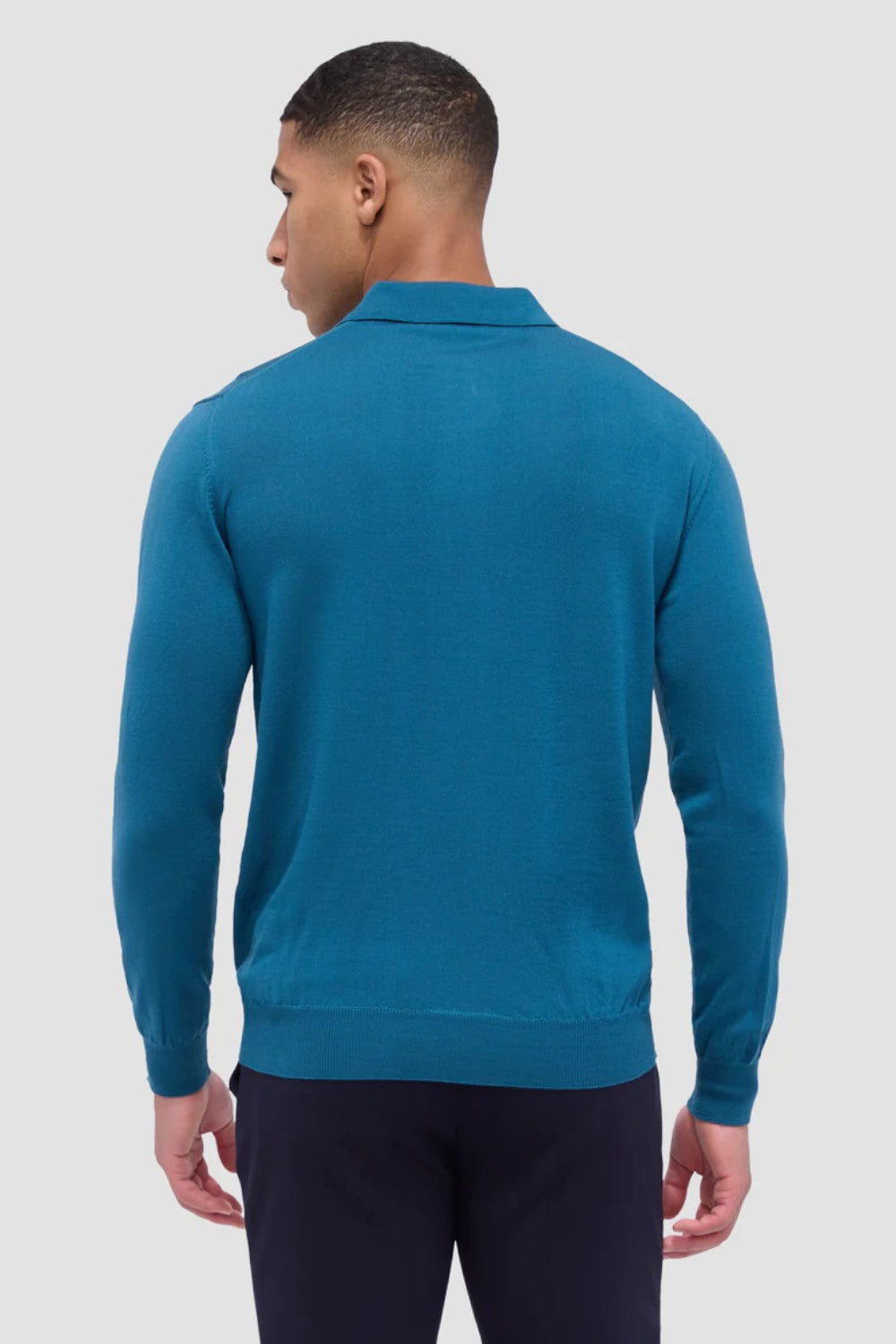 This timeless polo sweater in 100% extra fine merino wool with Harmony 4.0 special finish is made in Italy and features a classic three button placket and ribbed cuffs, and waistband. Unequalled in softness and comfort, it is made with a high twist yarn that is breathable, hygroscopic, water-repellent, machine washable, and crease-proof, ensuring long-lasting performance wash after wash.