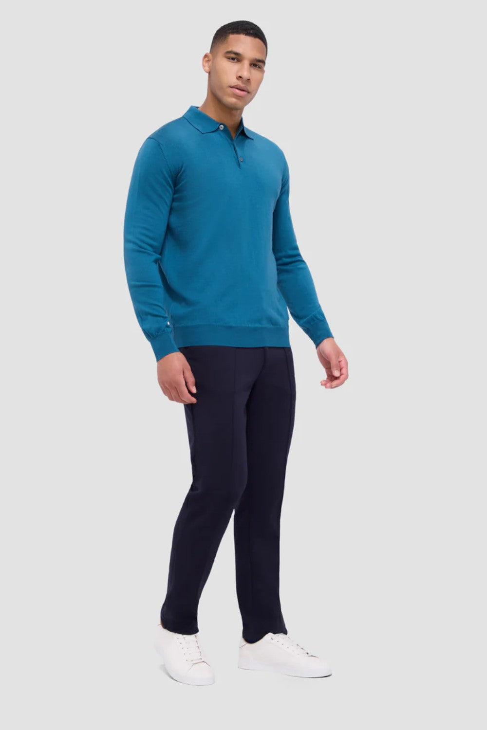 This timeless polo sweater in 100% extra fine merino wool with Harmony 4.0 special finish is made in Italy and features a classic three button placket and ribbed cuffs, and waistband. Unequalled in softness and comfort, it is made with a high twist yarn that is breathable, hygroscopic, water-repellent, machine washable, and crease-proof, ensuring long-lasting performance wash after wash.