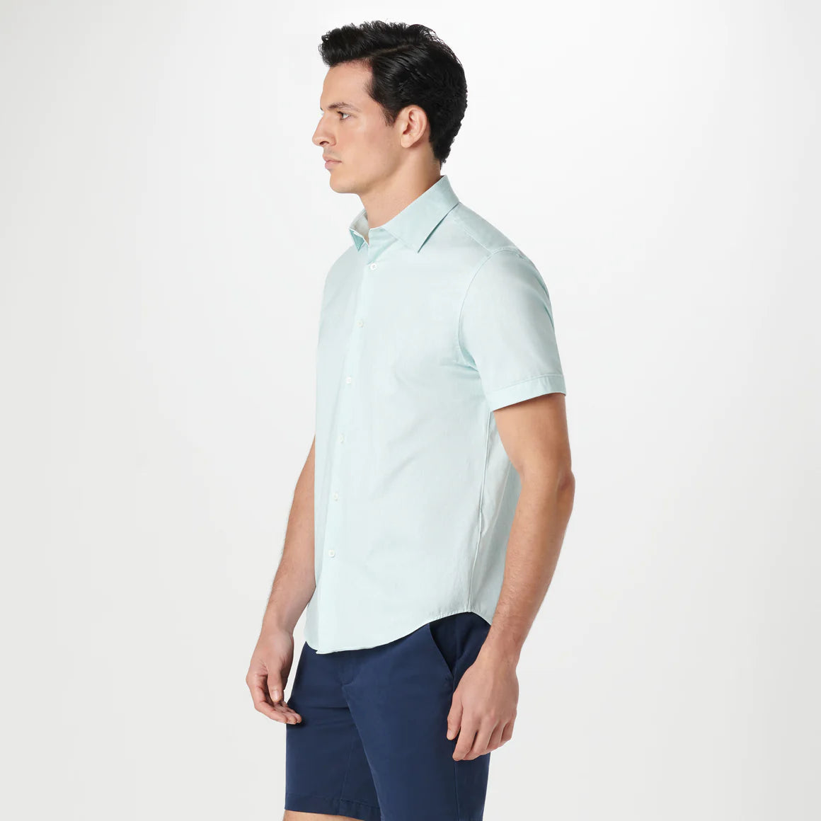 The Miles short-sleeved shirt features a chambray effect print on OoohCotton fabric, a point collar, genuine shell buttons, and a curved hem. OoohCotton is a double-mercerized, wrinkle-resistant, breathable, and easy-care cotton blend with 8-way stretch, quick-dry, and thermal comfort properties