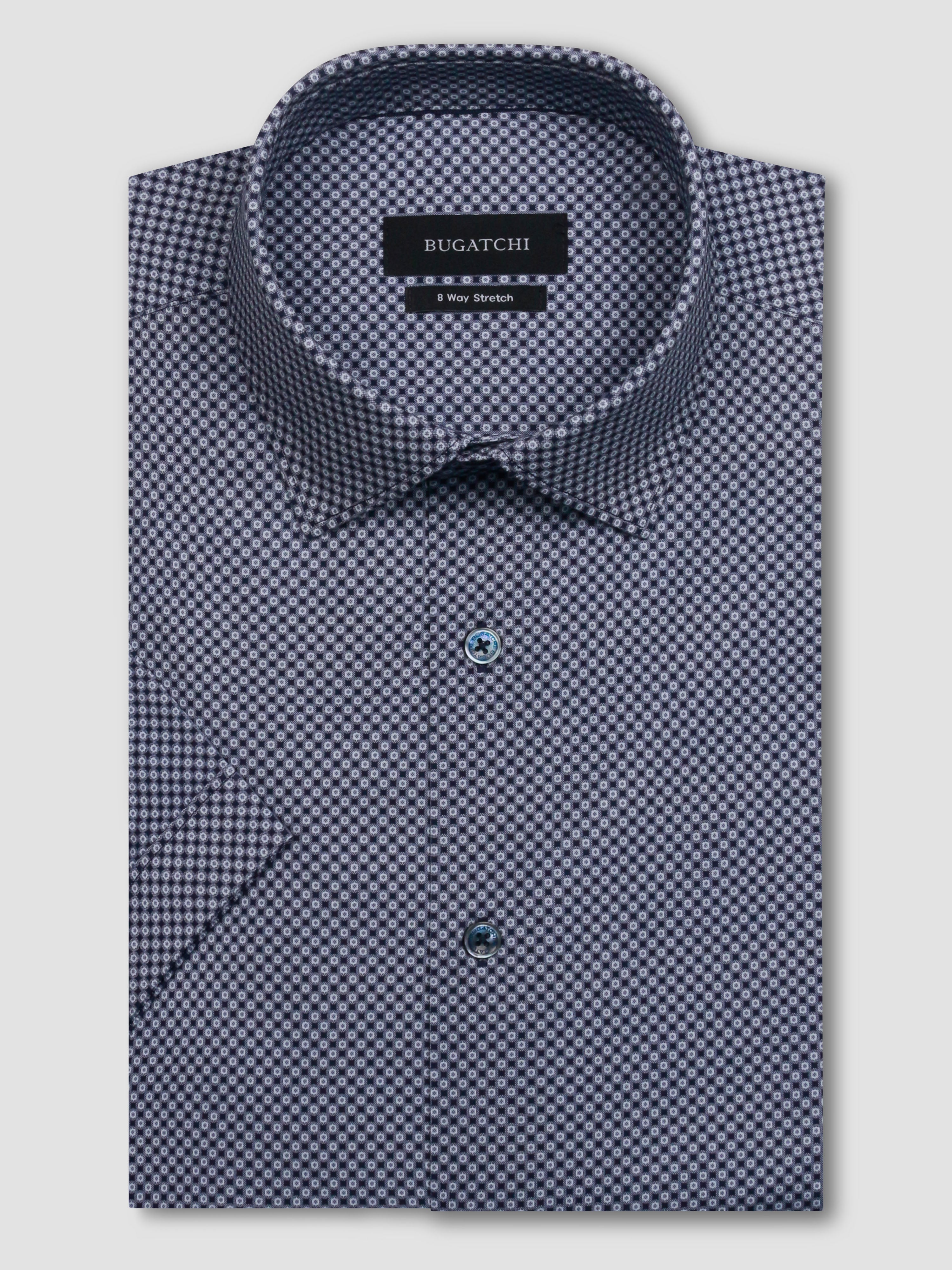 The Miles short-sleeved shirt features a geometric print on OoohCotton fabric, a point collar, genuine shell buttons, and a curved hem. OoohCotton is a double-mercerized, wrinkle-resistant, breathable, and easy-care cotton blend with 8-way stretch, quick-dry, and thermal comfort properties.