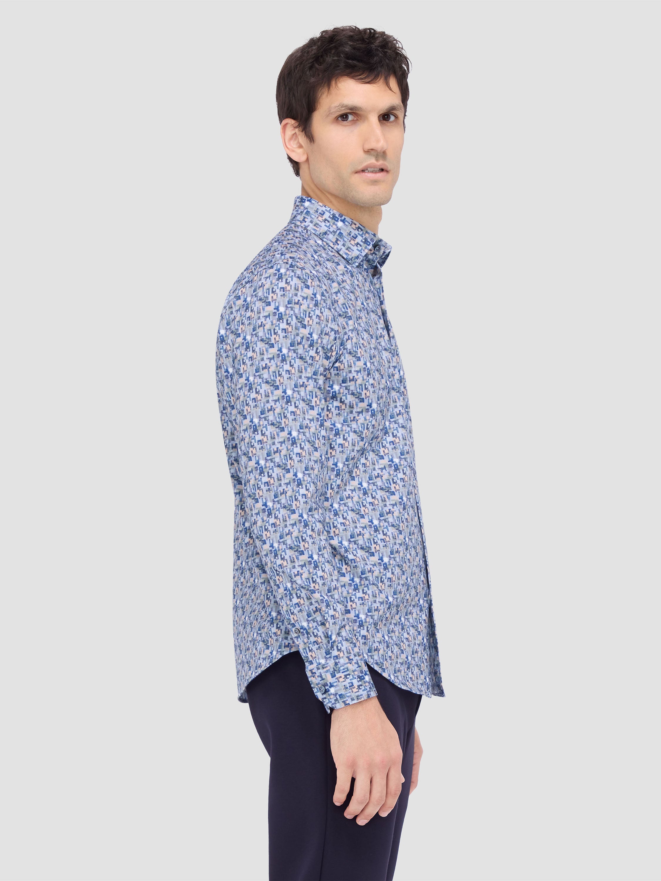 The JULES abstract print OoohCotton® shirt features a hidden button-down collar, adjustable notched cuffs, mother-of-pearl buttons, and a curved hem perfect for wearing tucked or untucked. Pair it with tailored trousers, chinos or jeans to look and feel your best every time. OoohCotton® is a performance, double-mercerized, wrinkle-resistant, breathable, and easy-care cotton blend with 8-way stretch, quick-dry, and thermal comfort properties.