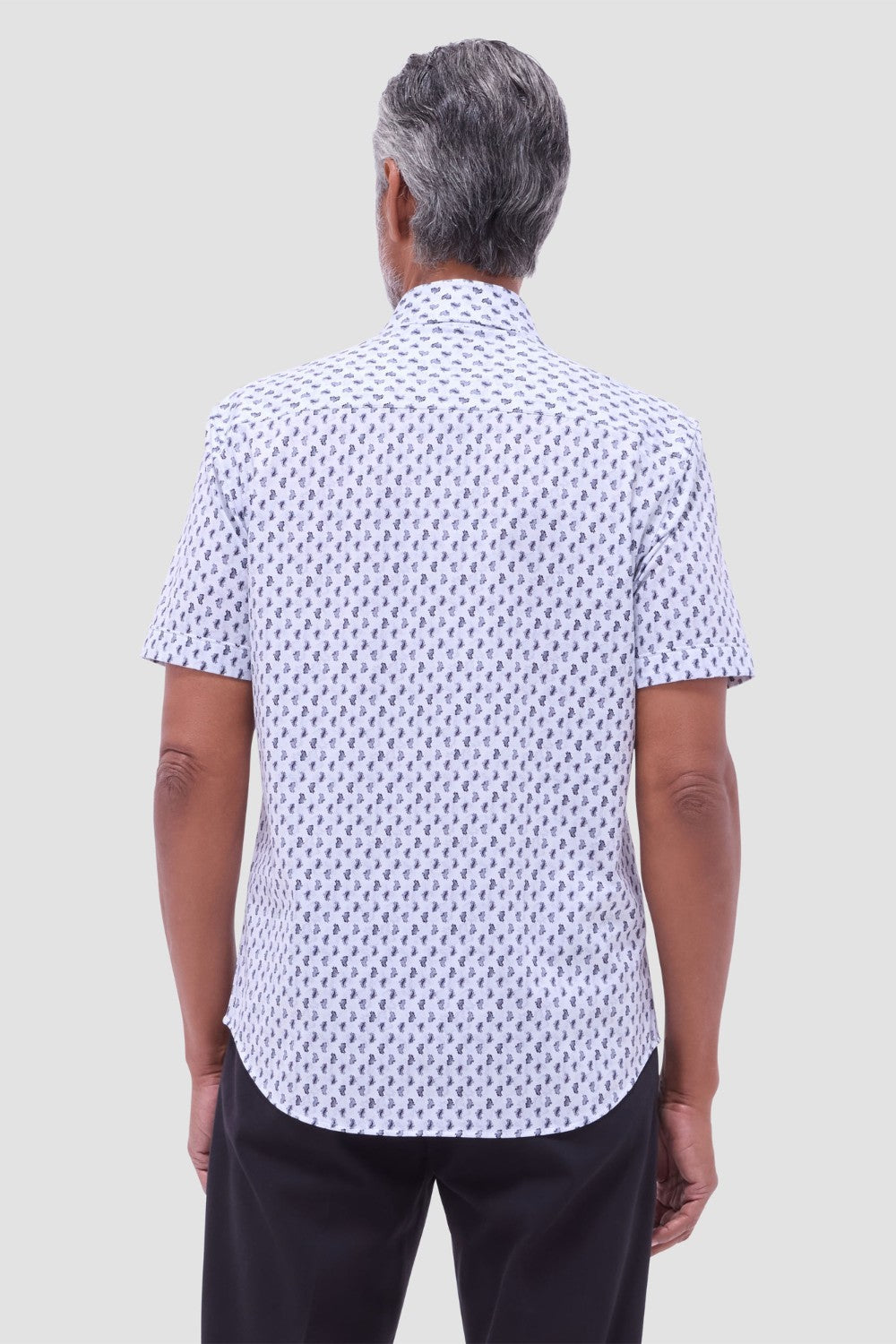 The Miles OoohCotton short-sleeve shirt in toucan print features a point collar, mother-of-pearl buttons, and a curved hem for a sleek tucked or untucked look. OoohCotton is a performance, double-mercerized, wrinkle-resistant, breathable, and easy-care cotton blend with 8-way stretch, quick-dry, and thermal comfort properties.
