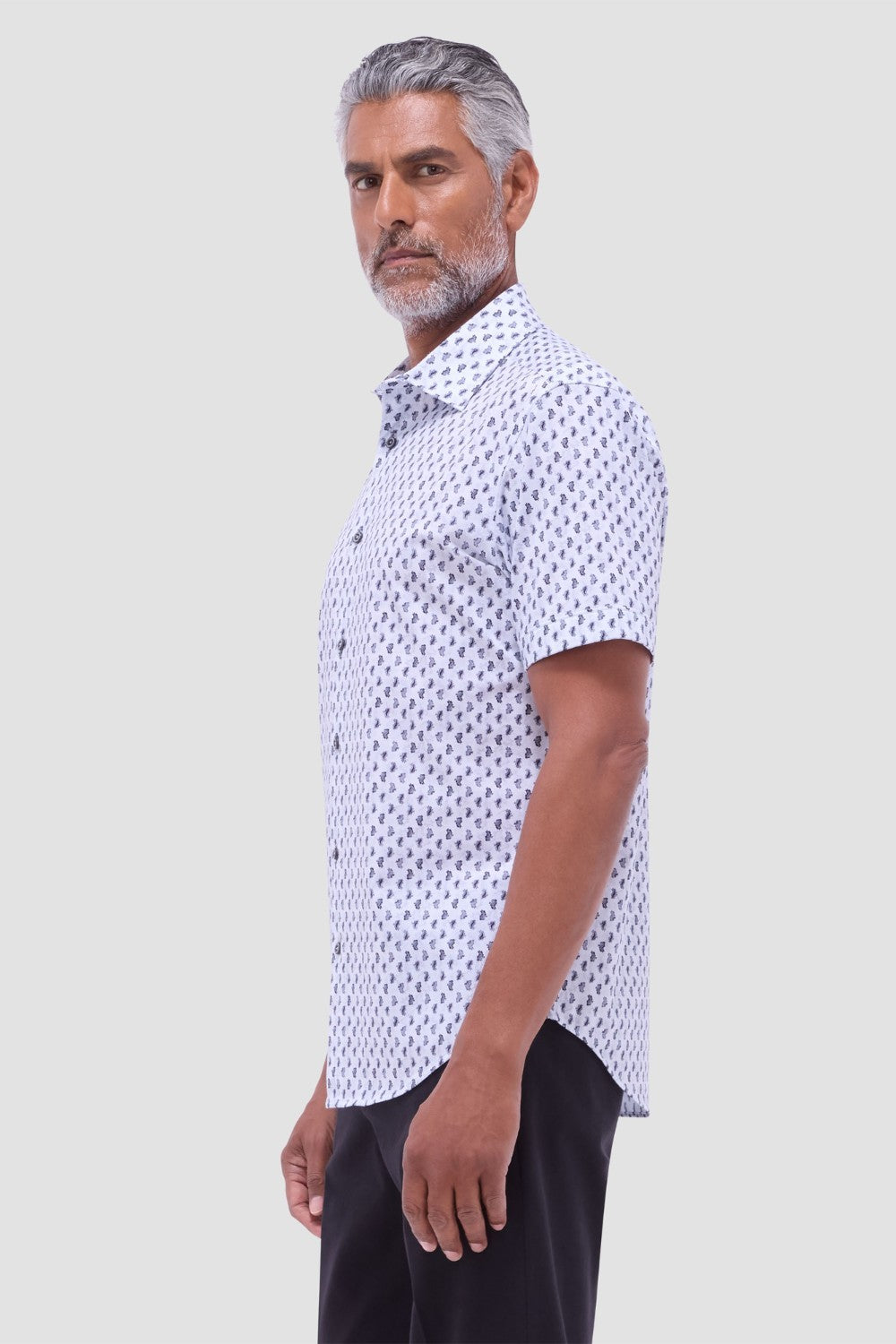 The Miles OoohCotton short-sleeve shirt in toucan print features a point collar, mother-of-pearl buttons, and a curved hem for a sleek tucked or untucked look. OoohCotton is a performance, double-mercerized, wrinkle-resistant, breathable, and easy-care cotton blend with 8-way stretch, quick-dry, and thermal comfort properties.