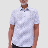 The Miles OoohCotton short-sleeve shirt in toucan print features a point collar, mother-of-pearl buttons, and a curved hem for a sleek tucked or untucked look. OoohCotton is a performance, double-mercerized, wrinkle-resistant, breathable, and easy-care cotton blend with 8-way stretch, quick-dry, and thermal comfort properties.