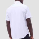 The Miles solid OoohCOtton short-sleeved shirt features a point collar, mother-of-pearl buttons, and a curved hem perfect for wearing tucked or untucked. OoohCOtton is a performance, double-mercerized, wrinkle-resistant, breathable, and easy-care cOtton blend with 8-way stretch, quick-dry, and thermal comfort properties.