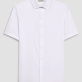 The Miles solid OoohCOtton short-sleeved shirt features a point collar, mother-of-pearl buttons, and a curved hem perfect for wearing tucked or untucked. OoohCOtton is a performance, double-mercerized, wrinkle-resistant, breathable, and easy-care cOtton blend with 8-way stretch, quick-dry, and thermal comfort properties.