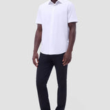 The Miles solid OoohCOtton short-sleeved shirt features a point collar, mother-of-pearl buttons, and a curved hem perfect for wearing tucked or untucked. OoohCOtton is a performance, double-mercerized, wrinkle-resistant, breathable, and easy-care cOtton blend with 8-way stretch, quick-dry, and thermal comfort properties.