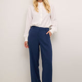 The Cream Cocamia Pant is a versatile and stylish addition to any wardrobe. With its blue colour, this pant offers a sleek and sophisticated look. The zip and button closure, along with the elastic back waist, provide a comfortable fit for all-day wear. Complete with pockets and belt loops, this pant offers both style and functionality.