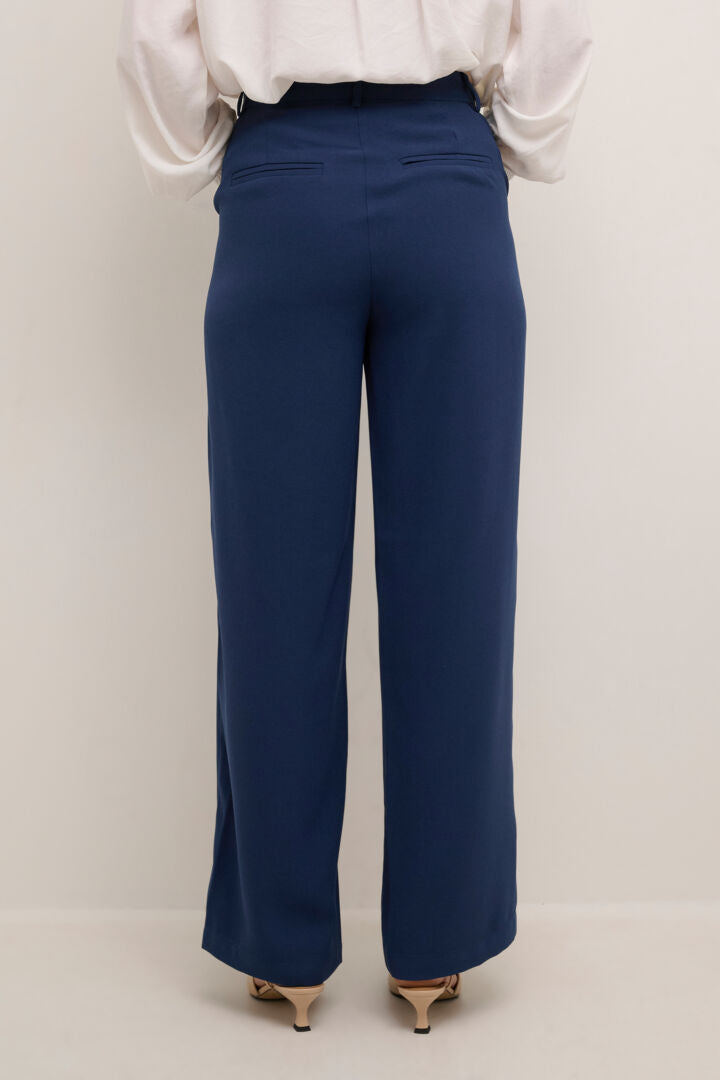 The Cream Cocamia Pant is a versatile and stylish addition to any wardrobe. With its blue colour, this pant offers a sleek and sophisticated look. The zip and button closure, along with the elastic back waist, provide a comfortable fit for all-day wear. Complete with pockets and belt loops, this pant offers both style and functionality.