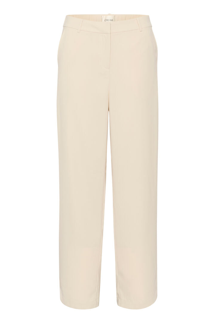 The Cream Cocamia Pant is a versatile and stylish addition to any wardrobe. With its summer sand colour, this pant offers a sleek and sophisticated look. The zip and button closure, along with the elastic back waist, provide a comfortable fit for all-day wear. Complete with pockets and belt loops, this pant offers both style and functionality.