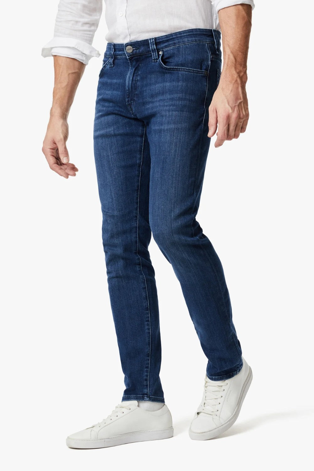 This pair of denim is perfect for the man seeking a distinguished look without compromising on comfort. These are cut from smooth, premium denim that features superior stretch and shape retention in a versatile wash that’s effortless to wear while enhancing the streamlined silhouette. A contemporary fit that’s endlessly flattering, these have a mid rise and tailored straight leg that features subtle tapering from the knee down.

