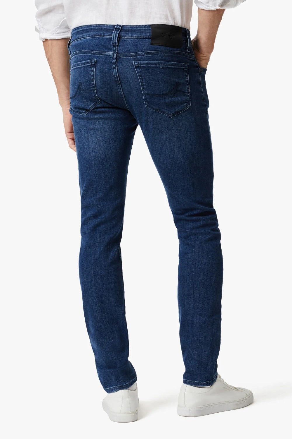 This pair of denim is perfect for the man seeking a distinguished look without compromising on comfort. These are cut from smooth, premium denim that features superior stretch and shape retention in a versatile wash that’s effortless to wear while enhancing the streamlined silhouette. A contemporary fit that’s endlessly flattering, these have a mid rise and tailored straight leg that features subtle tapering from the knee down.
