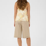The Cream Alitia Top features a soft, romantic aesthetic with a pretty floral pattern throughout. 