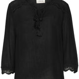 The Cream Bea 3/4 Sleeve Lace Blouse features a sleek black colour and a charming front tie with tassels. Elevate any outfit with this versatile piece, perfect for adding a touch of sophistication to your wardrobe.