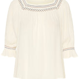 This Cream Bea Smock Blouse features a beautiful off-white colour with intricate black and brown embroidery on the neck and sleeves. With a delicate smocked design, this blouse exudes elegance and style. Perfect for any occasion, it is a must-have addition to any wardrobe.