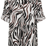 Zebra print shirt on a white background