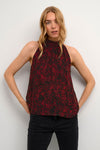 Crafted from 100% Viscose for a silky feel, this poppin' poppy red top will have you purring with style.
