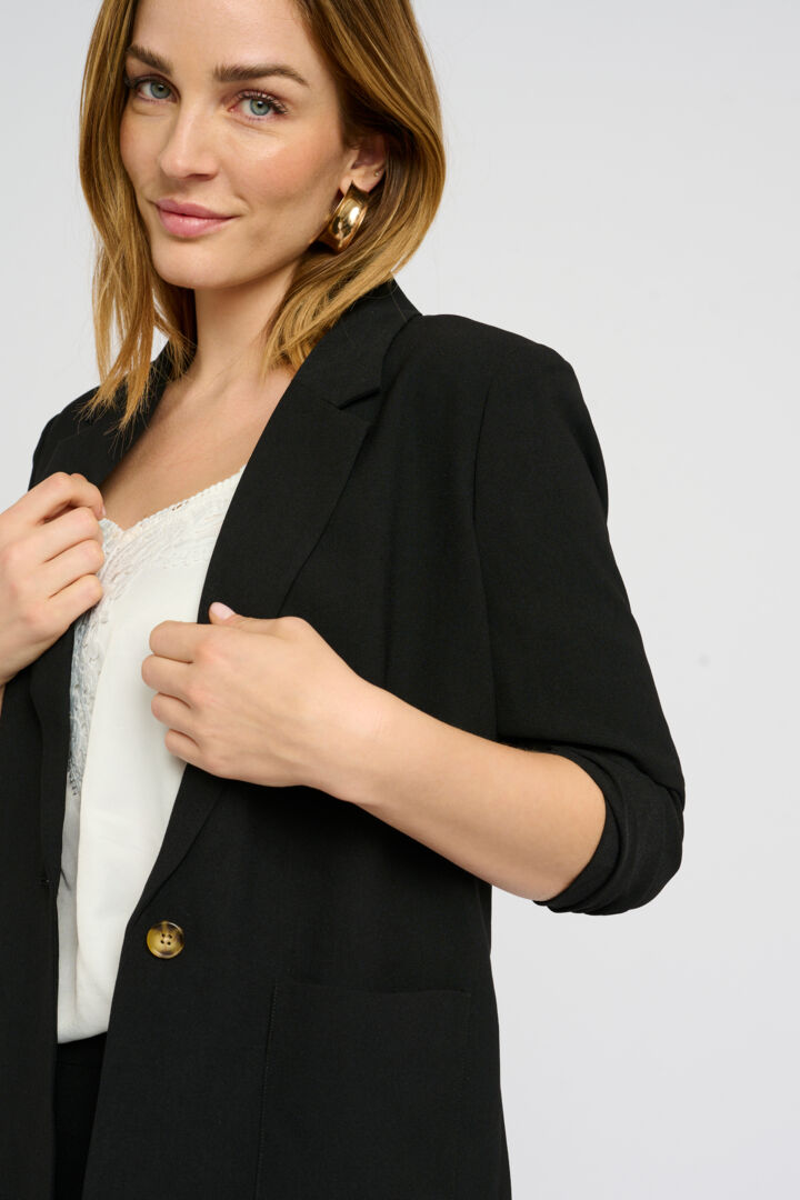 The Cream Cocamia Blazer is a versatile addition to any wardrobe. Its pitch black colour exudes elegance, while the 3/4 sleeves and functional pockets provide both practicality and style. With its one button closure and fully lined interior, this blazer is perfect for any occasion.