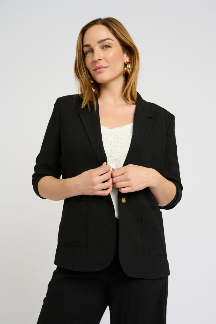 The Cream Cocamia Blazer is a versatile addition to any wardrobe. Its pitch black colour exudes elegance, while the 3/4 sleeves and functional pockets provide both practicality and style. With its one button closure and fully lined interior, this blazer is perfect for any occasion.