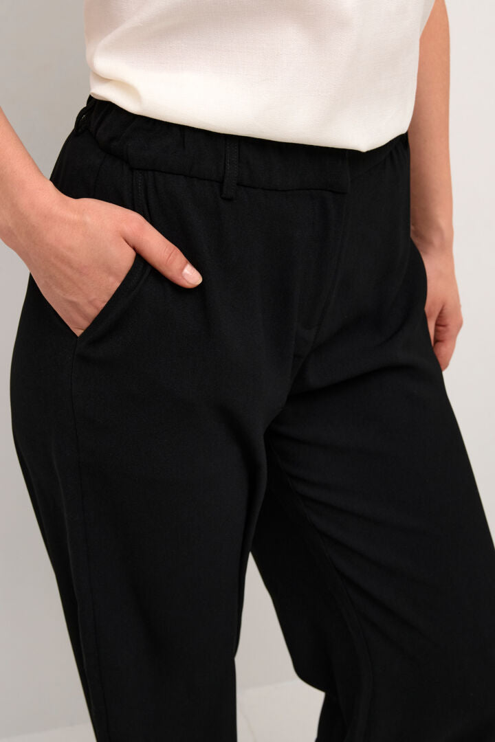 Spice up any outfit with the Cream Cocamia Dress Pant! This black dress pant has a super cool sustainable construction with 50% polyester and 50% recycled polyester. 