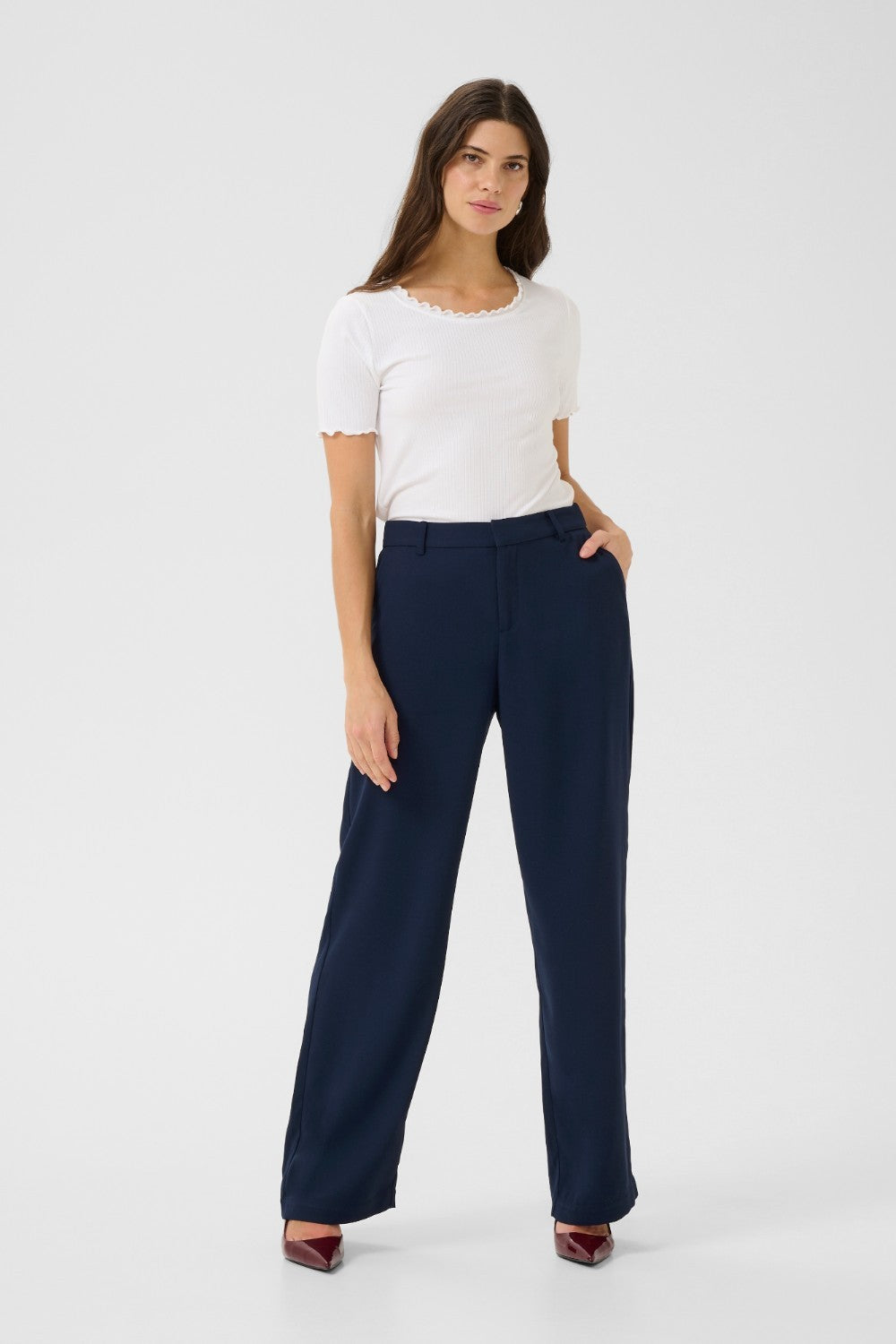 The Cream Cocamia Pant is a versatile and stylish addition to any wardrobe. This pant offers a sleek and sophisticated look, and the zip and button closure, along with the elastic back waist, provide a comfortable fit for all-day wear. Complete with pockets and belt loops, this pant offers both style and functionality.