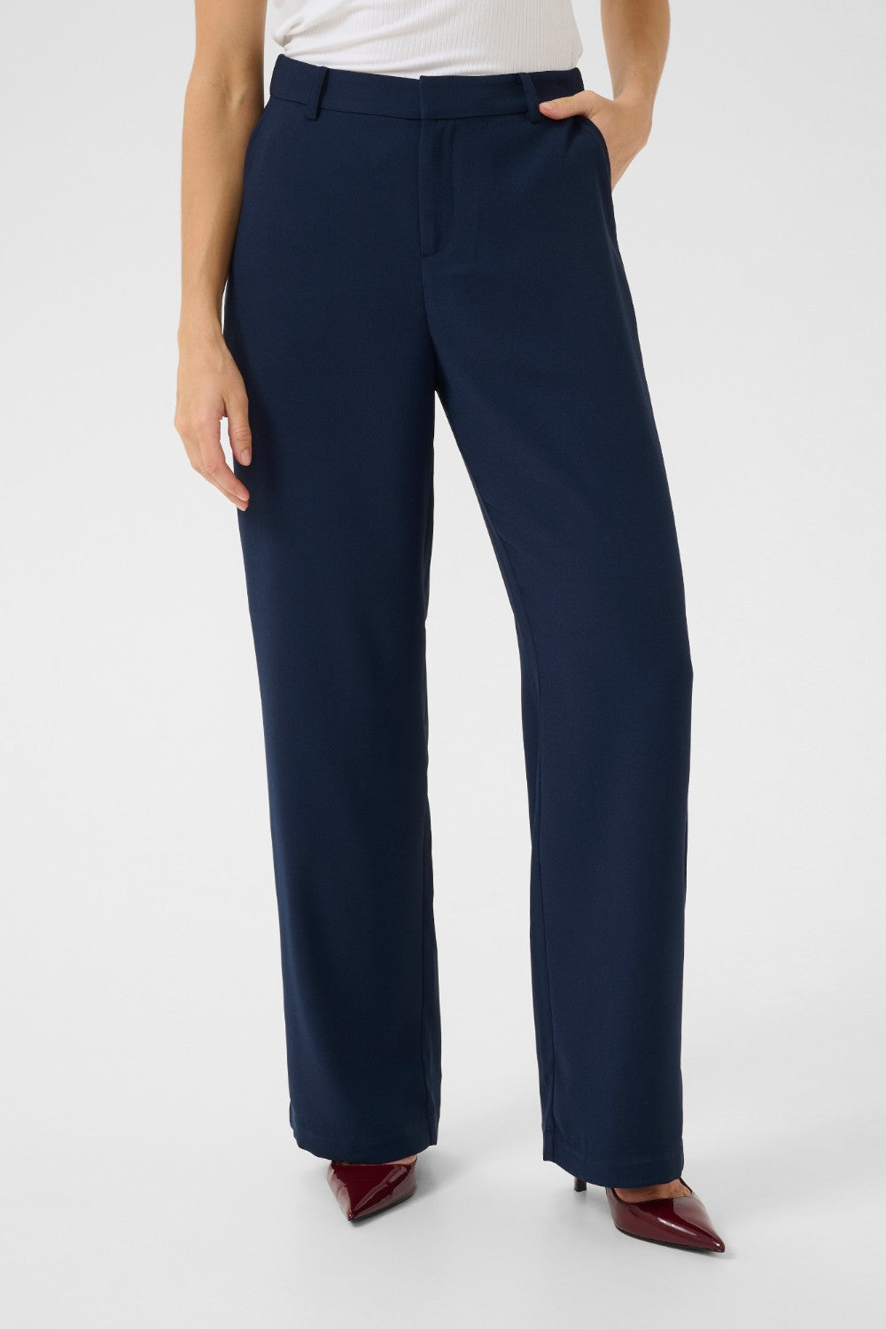 The Cream Cocamia Pant is a versatile and stylish addition to any wardrobe. This pant offers a sleek and sophisticated look, and the zip and button closure, along with the elastic back waist, provide a comfortable fit for all-day wear. Complete with pockets and belt loops, this pant offers both style and functionality.