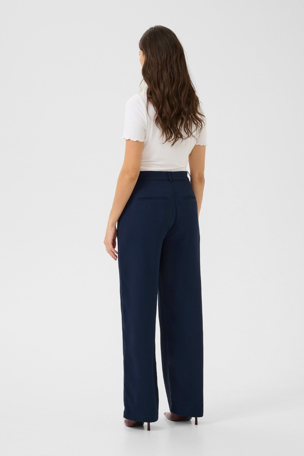 The Cream Cocamia Pant is a versatile and stylish addition to any wardrobe. This pant offers a sleek and sophisticated look, and the zip and button closure, along with the elastic back waist, provide a comfortable fit for all-day wear. Complete with pockets and belt loops, this pant offers both style and functionality.