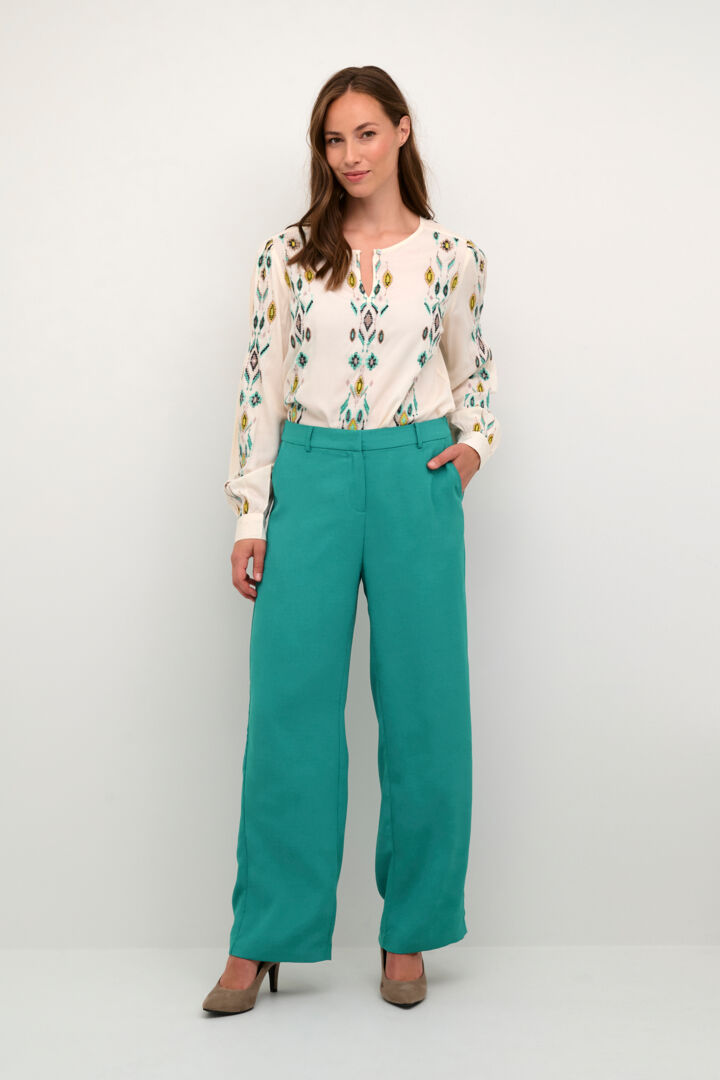 The Cream Cocamia Pant is a versatile and stylish addition to any wardrobe. The zip and button closure, along with the elastic back waist, provide a comfortable fit for all-day wear. Complete with pockets and belt loops, this pant offers both style and functionality.